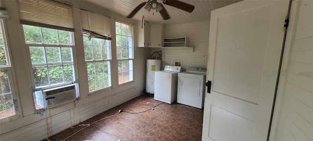 clothes washing area featuring washer and dryer, wood walls, cooling unit, ceiling fan, and electric water heater