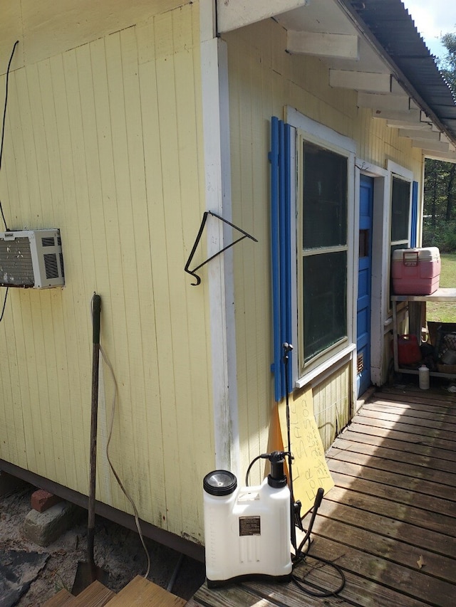 view of side of home featuring a wooden deck