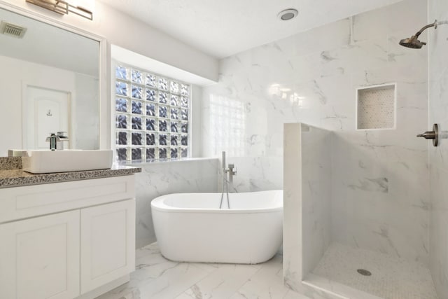 bathroom featuring tile walls, vanity, and plus walk in shower