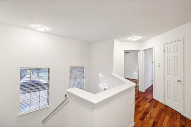 hall with dark hardwood / wood-style floors