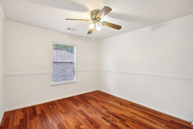 spare room featuring ornamental molding, hardwood / wood-style floors, and ceiling fan