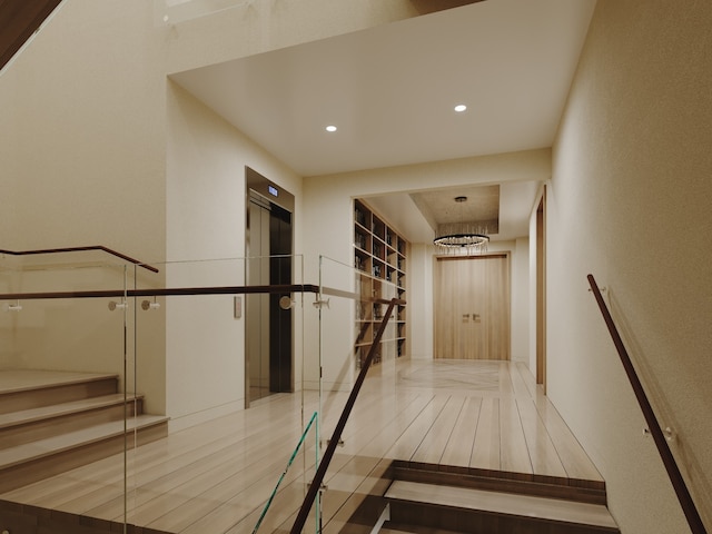 hall featuring elevator and hardwood / wood-style flooring