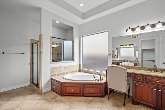 bathroom featuring vanity, independent shower and bath, and tile patterned floors