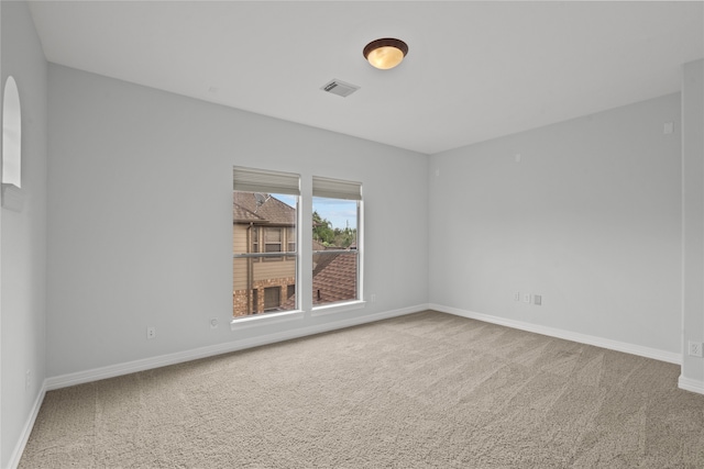 spare room featuring carpet floors