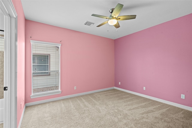 unfurnished room featuring ceiling fan and carpet flooring