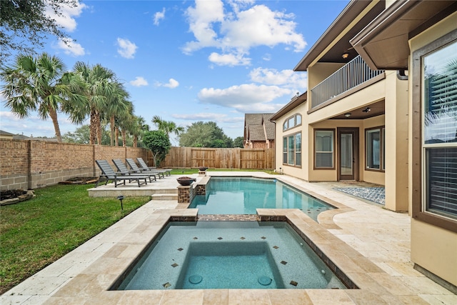 view of swimming pool featuring an in ground hot tub and a patio area