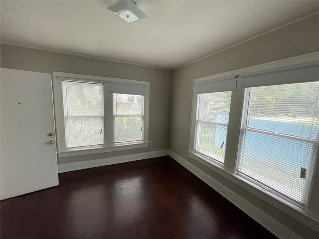 empty room featuring dark wood-type flooring