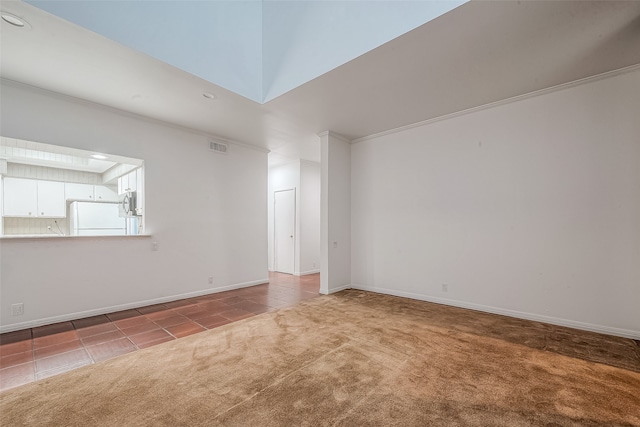 carpeted spare room featuring ornamental molding