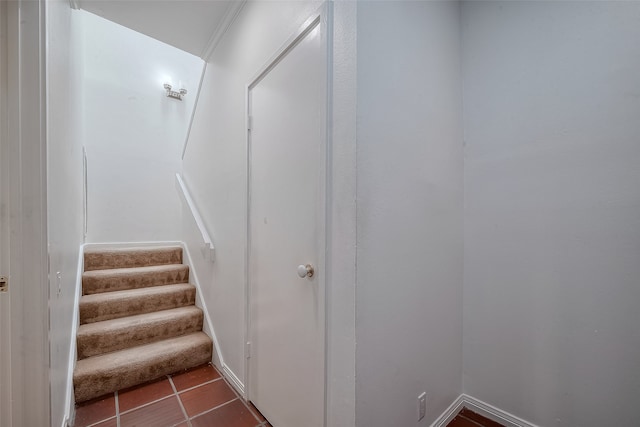 stairway featuring tile patterned flooring