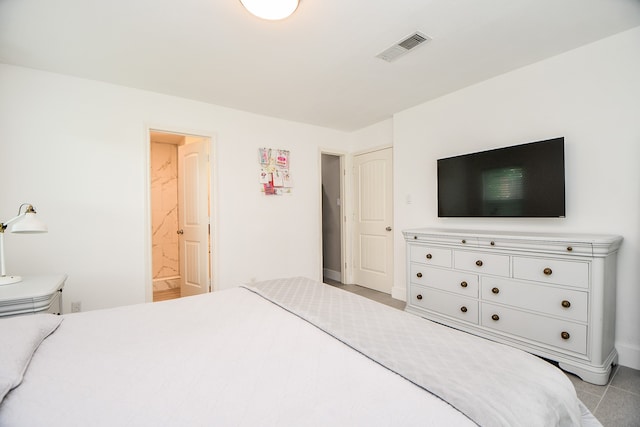 tiled bedroom with ensuite bath