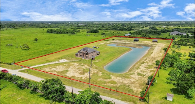 birds eye view of property featuring a water view and a rural view