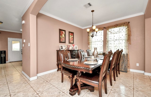 dining room featuring a notable chandelier and ornamental molding