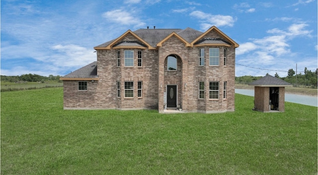 view of front of property with a front lawn