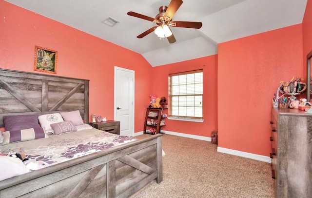 carpeted bedroom with ceiling fan and lofted ceiling