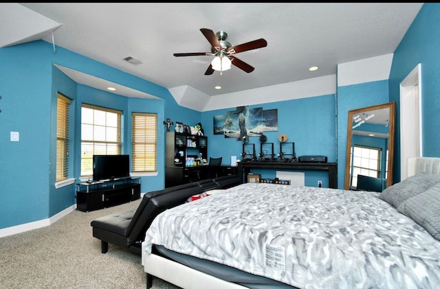 carpeted bedroom with lofted ceiling and ceiling fan