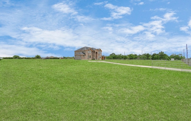 view of yard with a rural view