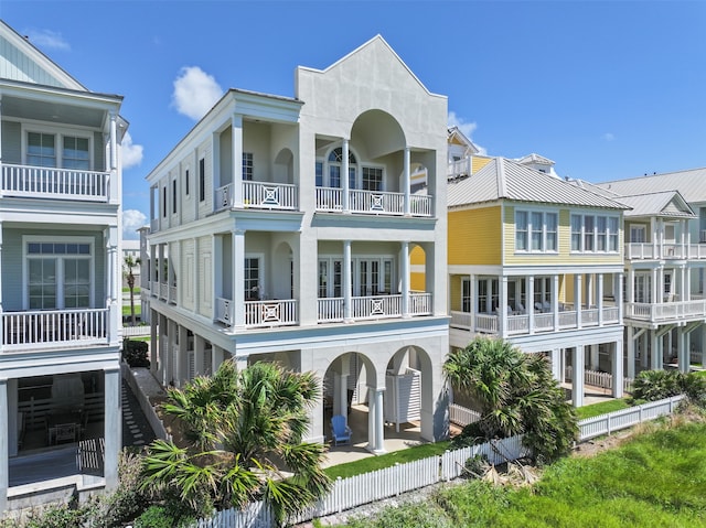 back of property with a balcony