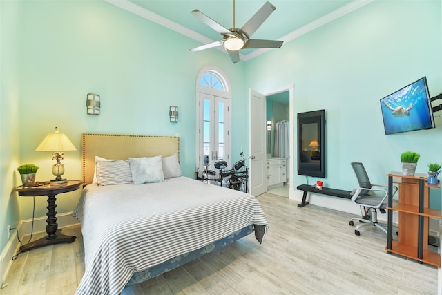 1745 Seaside Dr, Galveston, TX 77550 - bedroom featuring connected bathroom, wood finished floors, french doors, baseboards, and ornamental molding