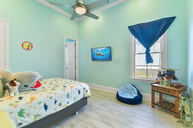 1745 Seaside Dr, Galveston, TX 77550 - bedroom featuring crown molding, wood finished floors, and baseboards