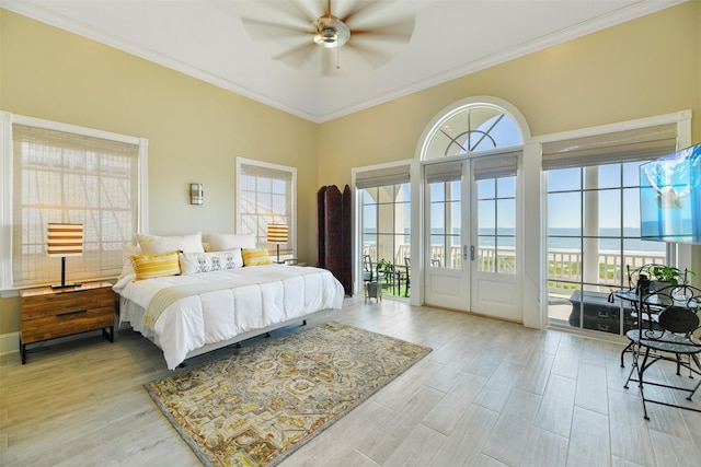 1745 Seaside Dr, Galveston, TX 77550 - bedroom featuring multiple windows, wood finished floors, and access to exterior