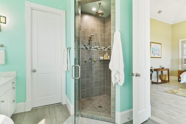 1745 Seaside Dr, Galveston, TX 77550 - bathroom featuring visible vents, baseboards, and a shower stall