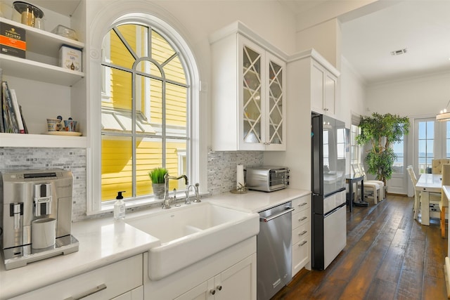1745 Seaside Dr, Galveston, TX 77550 - kitchen featuring white cabinetry, stainless steel appliances, and visible vents