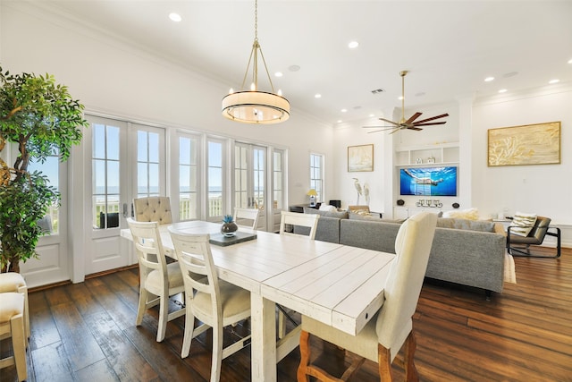 1745 Seaside Dr, Galveston, TX 77550 - dining room with crown molding, ceiling fan with notable chandelier, dark wood-style floors, and recessed lighting