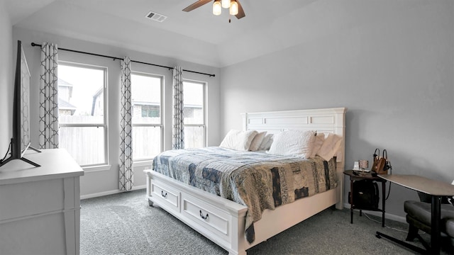 carpeted bedroom featuring lofted ceiling and ceiling fan