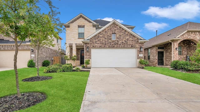 view of front of home featuring a front lawn and a garage