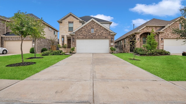 view of front of property featuring a garage and a front lawn