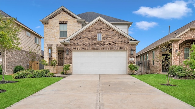 front of property featuring a garage and a front lawn