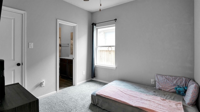 bedroom featuring carpet floors and ensuite bath