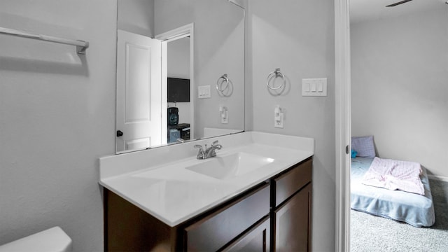 bathroom featuring vanity and toilet