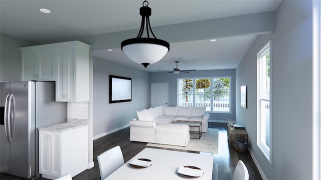 living room with ceiling fan and dark hardwood / wood-style flooring