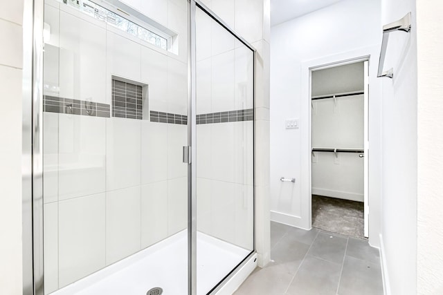 bathroom with tile patterned floors and an enclosed shower