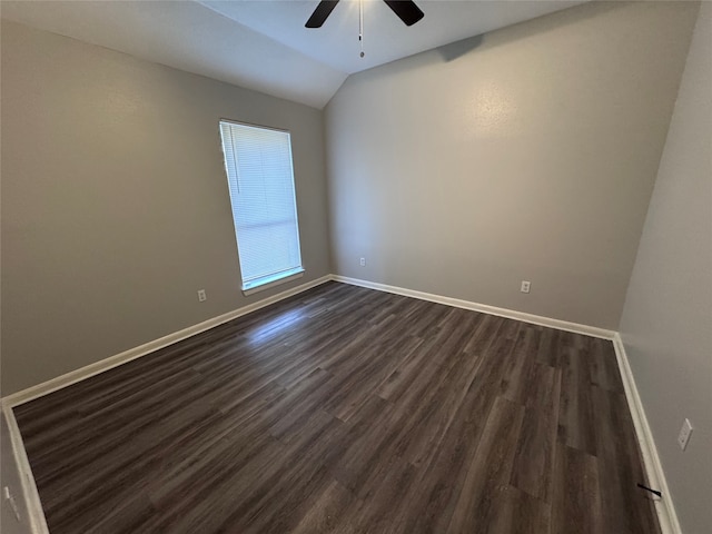 unfurnished room with lofted ceiling, ceiling fan, and dark hardwood / wood-style flooring