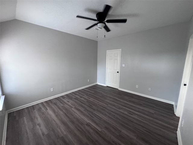 interior space featuring ceiling fan, a textured ceiling, lofted ceiling, and dark hardwood / wood-style floors