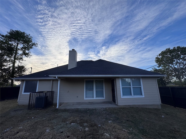 back of property with a patio area