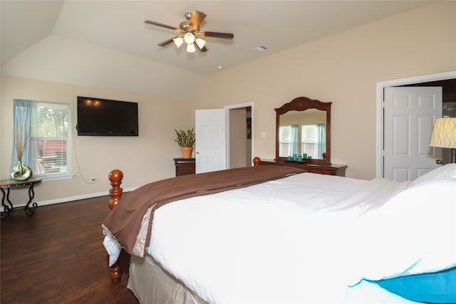 bedroom with dark hardwood / wood-style flooring and ceiling fan