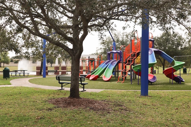 view of playground featuring a lawn