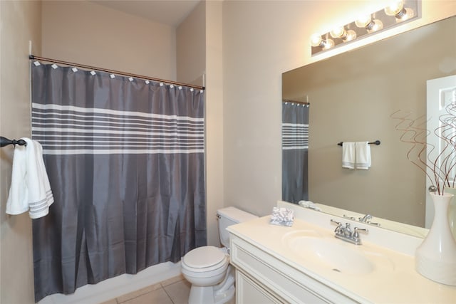 full bathroom featuring toilet, vanity, shower / bath combo with shower curtain, and tile patterned floors