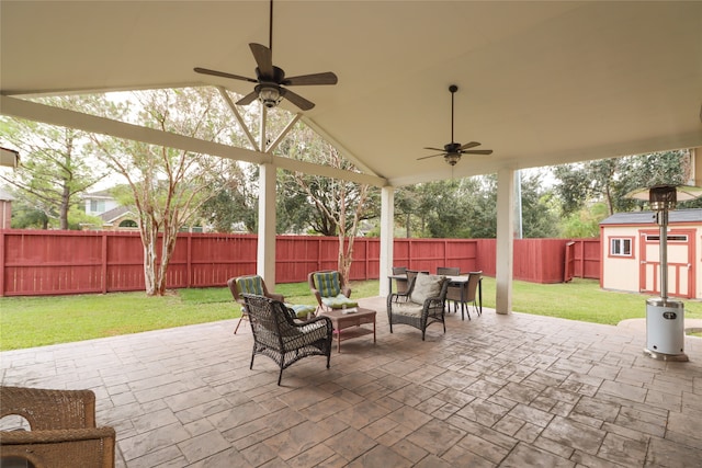 view of patio with a shed and ceiling fan