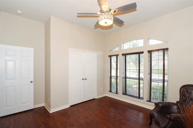 unfurnished room with ceiling fan and dark hardwood / wood-style floors