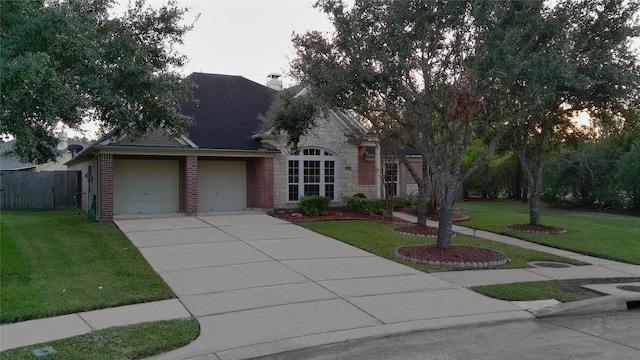 view of front facade featuring a front lawn and a garage