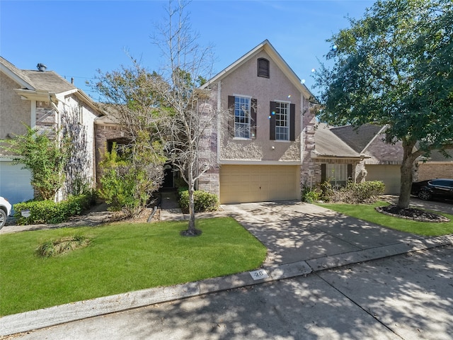 view of front of property featuring a front yard and a garage