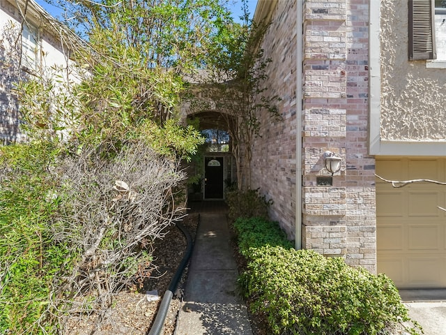 property entrance with a garage