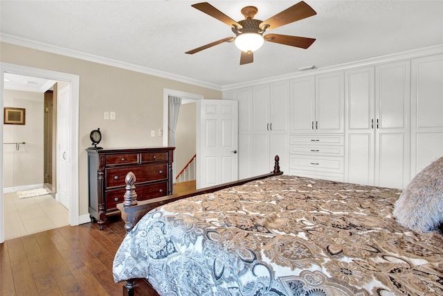 bedroom with dark hardwood / wood-style flooring, a closet, ceiling fan, and ornamental molding