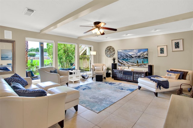 living room featuring beamed ceiling, ceiling fan, light tile patterned floors, and ornamental molding