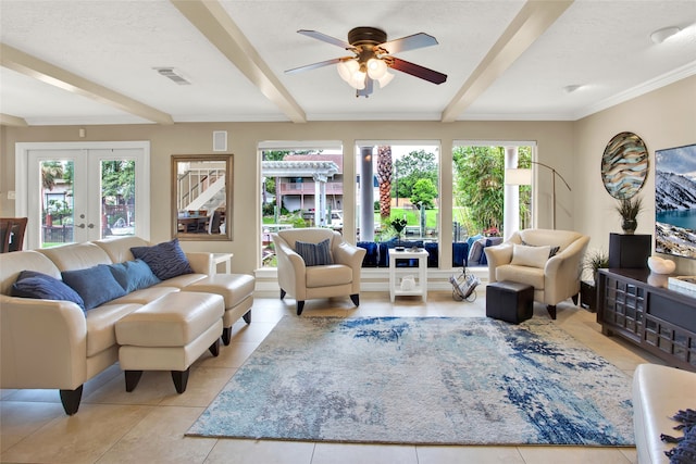 tiled living room with beamed ceiling, french doors, and plenty of natural light