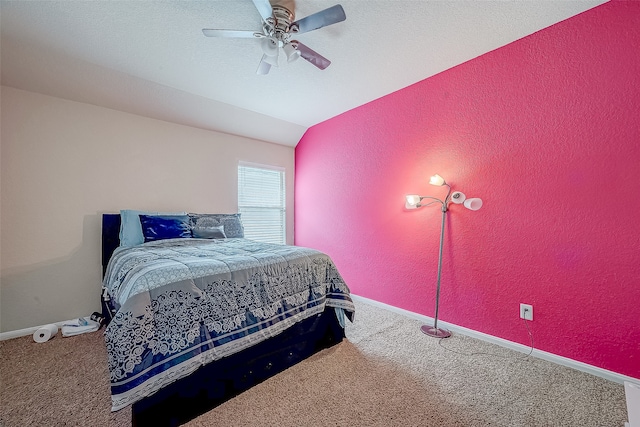 bedroom featuring carpet, lofted ceiling, and ceiling fan